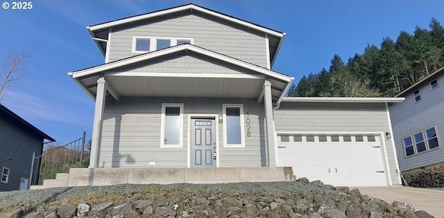 1028 Forest Heights St, Sutherlin, OR 97479 - view of front of house with concrete driveway, an attached garage, and stairway