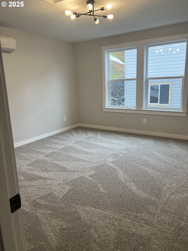 1028 Forest Heights St, Sutherlin, OR 97479 - carpeted empty room with an AC wall unit and a chandelier