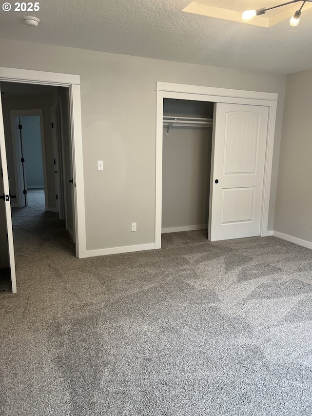 1028 Forest Heights St, Sutherlin, OR 97479 - unfurnished bedroom with carpet floors, a closet, and a textured ceiling