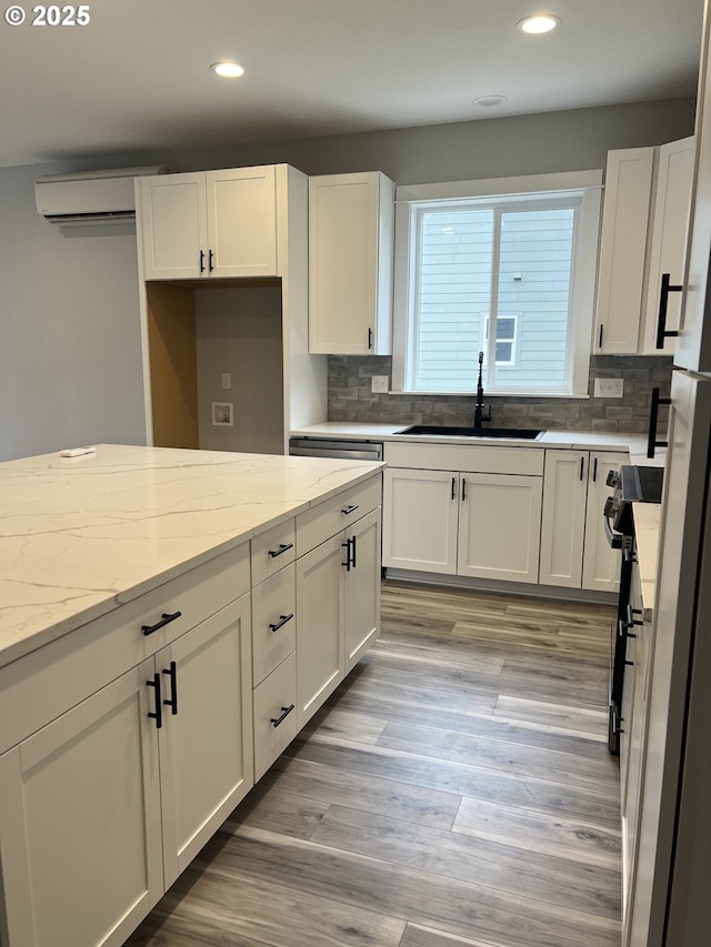 1028 Forest Heights St, Sutherlin, OR 97479 - kitchen with a sink, recessed lighting, white cabinets, and light stone countertops