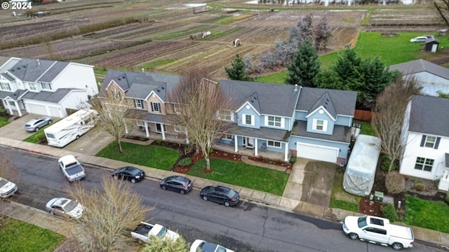 birds eye view of property with a rural view