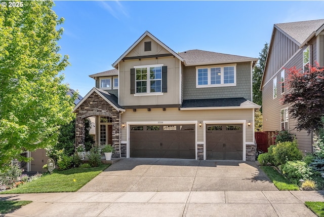 3356 NW 153rd Ter, Portland, OR 97229 - craftsman house featuring stone siding, driveway, an attached garage, a shingled roof, and board and batten siding