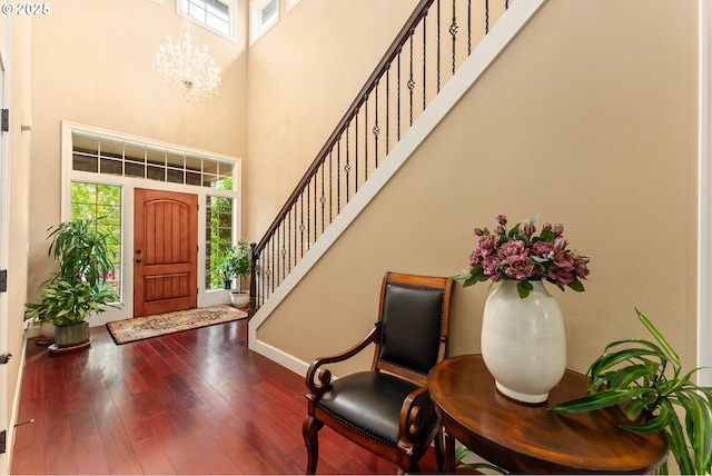 3356 NW 153rd Ter, Portland, OR 97229 - foyer featuring a high ceiling, stairway, dark wood-type flooring, and a chandelier