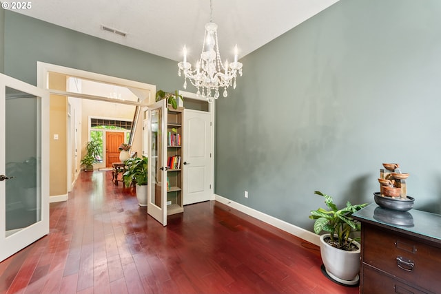 3356 NW 153rd Ter, Portland, OR 97229 - dining room with a chandelier, french doors, and dark wood-type flooring