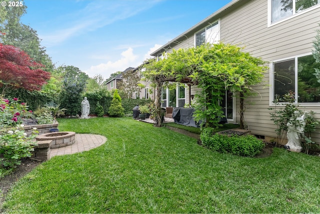 3356 NW 153rd Ter, Portland, OR 97229 - view of grassy yard featuring an outdoor fire pit and a patio