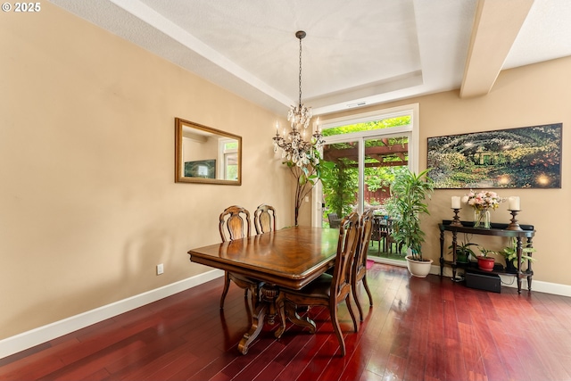 3356 NW 153rd Ter, Portland, OR 97229 - dining room featuring dark wood-style flooring, a chandelier, and a tray ceiling
