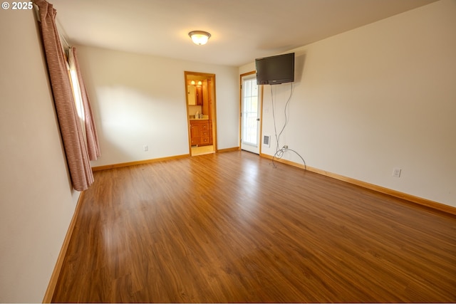 745 N 8th St, Lakeside, OR 97449 - unfurnished room featuring wood finished floors and baseboards