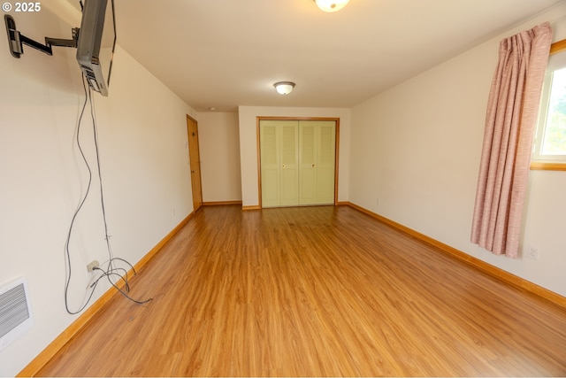 745 N 8th St, Lakeside, OR 97449 - unfurnished bedroom with light wood-style flooring, baseboards, and a closet