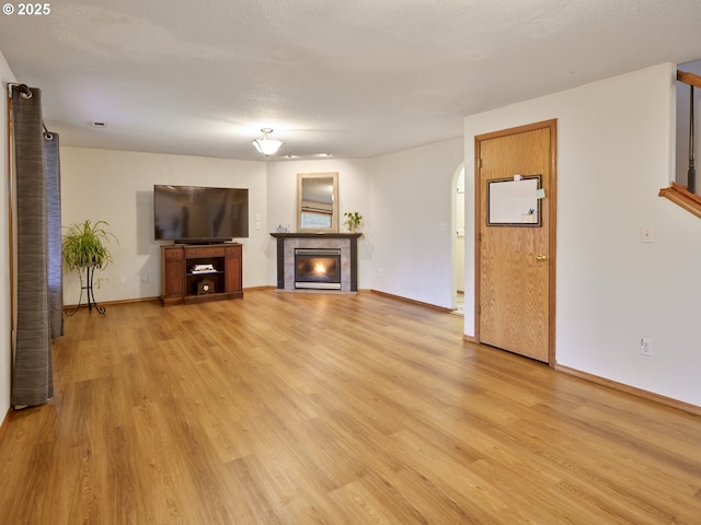 14604 NW 7th Pl, Vancouver, WA 98685 - unfurnished living room featuring light wood finished floors and a fireplace