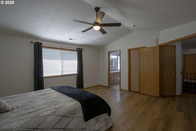 14604 NW 7th Pl, Vancouver, WA 98685 - bedroom featuring light wood-type flooring, vaulted ceiling, ceiling fan, and connected bathroom