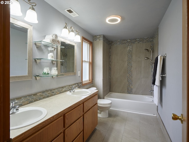 14604 NW 7th Pl, Vancouver, WA 98685 - full bath with double vanity, shower / bath combination, decorative backsplash, and tile patterned floors