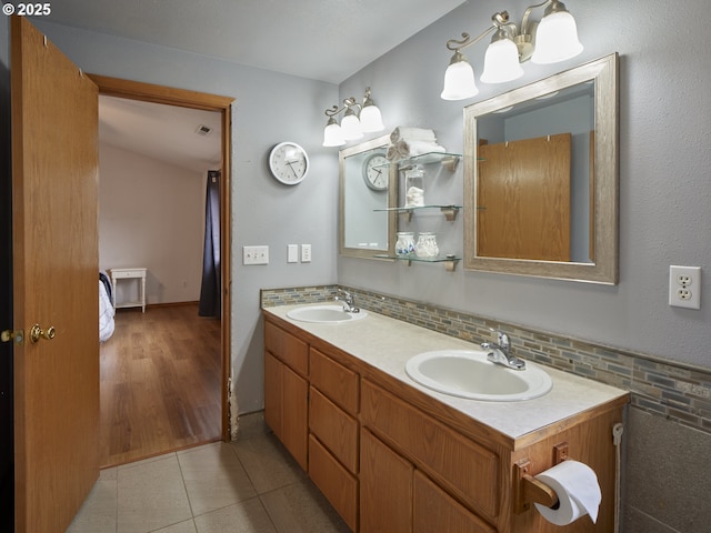 14604 NW 7th Pl, Vancouver, WA 98685 - bathroom with double vanity, tile patterned floors, and decorative backsplash