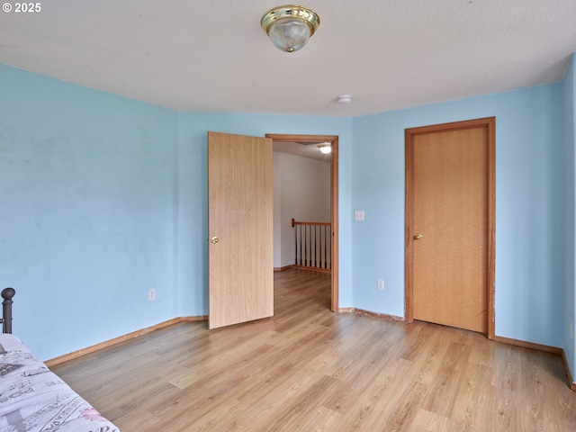 14604 NW 7th Pl, Vancouver, WA 98685 - unfurnished bedroom featuring light wood-type flooring and baseboards