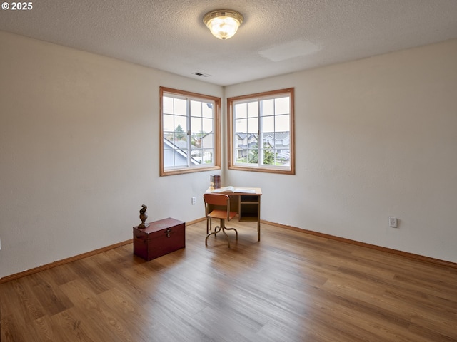 14604 NW 7th Pl, Vancouver, WA 98685 - empty room featuring wood finished floors and a textured ceiling
