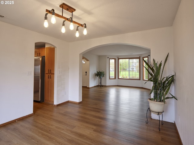 14604 NW 7th Pl, Vancouver, WA 98685 - spare room with wood finished floors and arched walkways