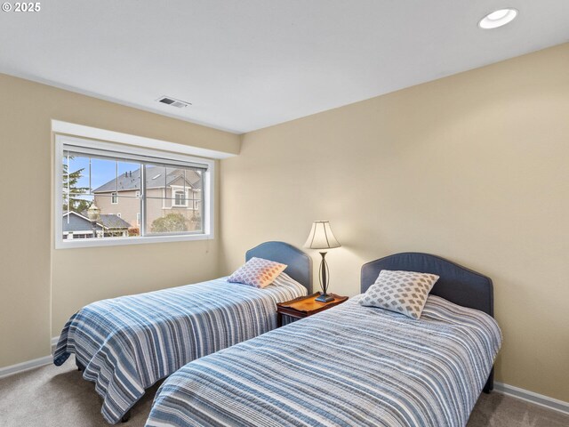 carpeted bedroom with recessed lighting, visible vents, and baseboards