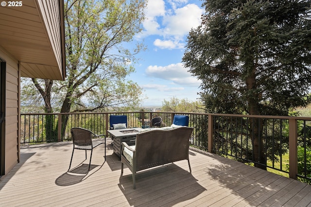 wooden deck with a fire pit