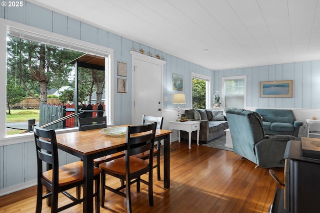 dining space with hardwood / wood-style floors