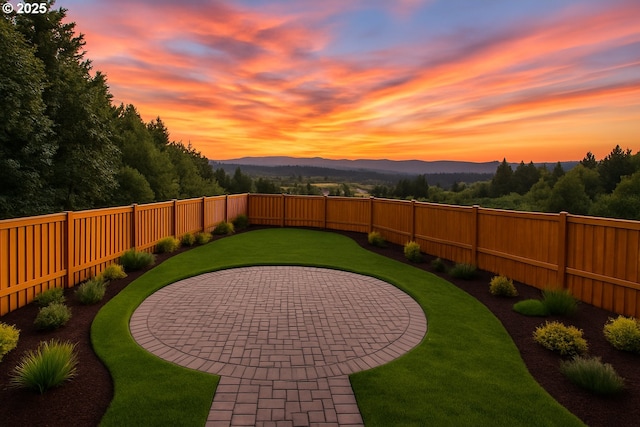 17590 SW Steens Ln, Beaverton, OR 97007 - yard at dusk with a patio area and a mountain view