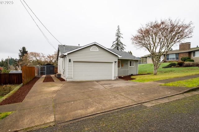 view of front of property with a front yard and a garage