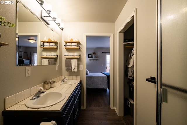 bathroom with wood-type flooring and vanity