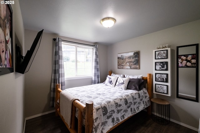 bedroom featuring dark wood-type flooring