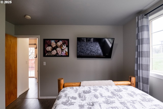 bedroom featuring dark hardwood / wood-style flooring