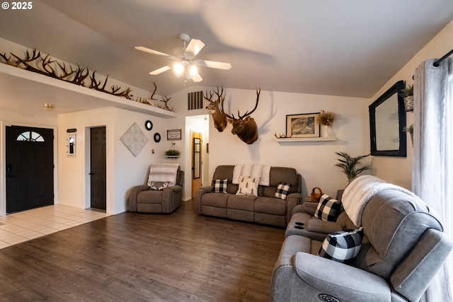 living room featuring light hardwood / wood-style floors, lofted ceiling, and ceiling fan