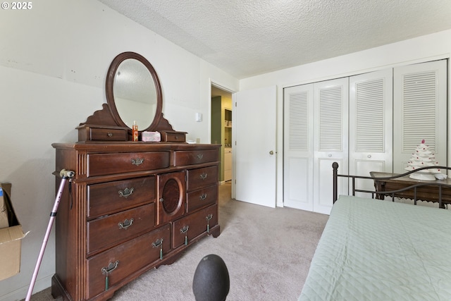 43605 State Highway 38 Unit 22, Reedsport, OR 97467 - bedroom with a closet, light colored carpet, and a textured ceiling