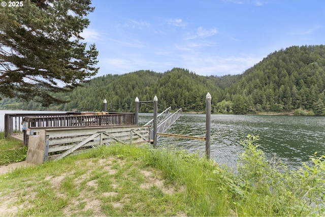 43605 State Highway 38 Unit 22, Reedsport, OR 97467 - dock featuring a forest view and a water view