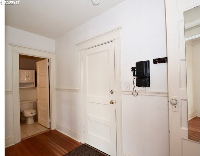 entryway with wood finished floors