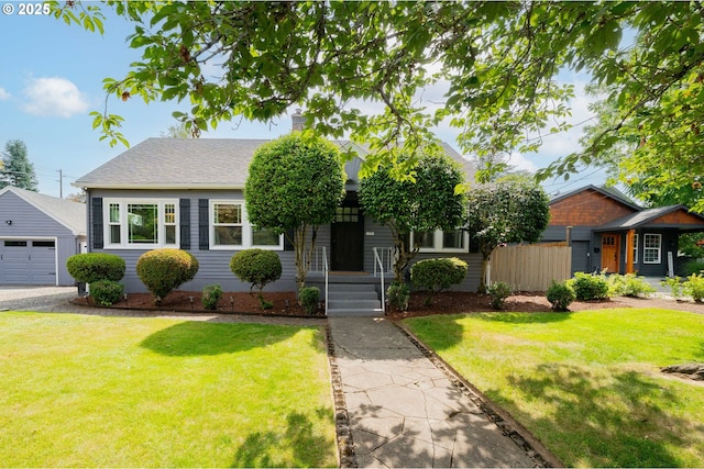 438 SE Roberts Ave, Gresham, OR 97080 - view of front of property featuring an outbuilding, a front lawn, a garage, and roof with shingles