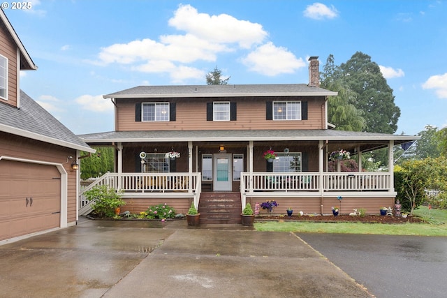 14504 SE Old Barn Ln, Damascus, OR 97089 - view of front of home featuring a chimney, covered porch, driveway, a garage, and roof with shingles