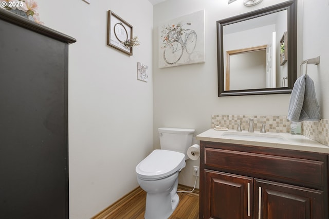 14504 SE Old Barn Ln, Damascus, OR 97089 - bathroom featuring wood finished floors, toilet, vanity, and decorative backsplash