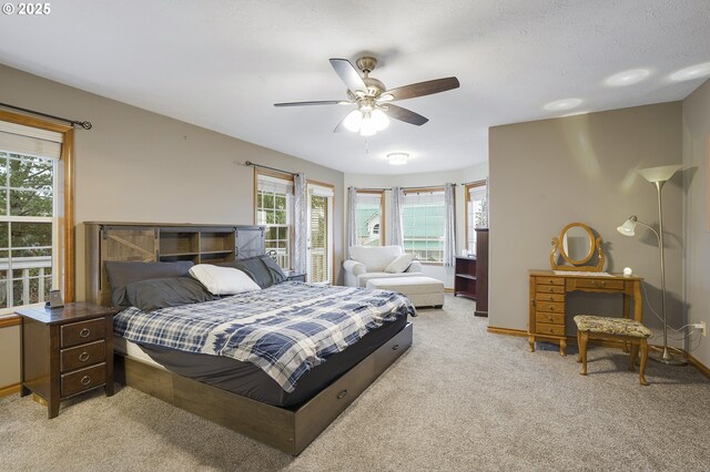 14504 SE Old Barn Ln, Damascus, OR 97089 - bedroom with light colored carpet, ceiling fan, and baseboards