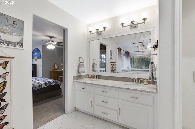 14504 SE Old Barn Ln, Damascus, OR 97089 - ensuite bathroom featuring double vanity, a ceiling fan, marble finish flooring, and a bathtub