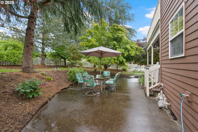 14504 SE Old Barn Ln, Damascus, OR 97089 - fenced backyard with a patio area and outdoor dining space