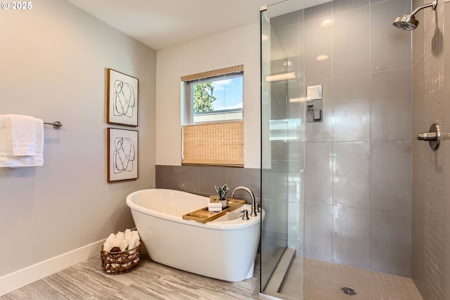 7952 SE 6th Ave, Portland, OR 97202 - full bathroom with a shower stall, a freestanding tub, and baseboards