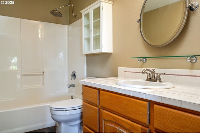 bathroom with shower / bath combination, vanity, and toilet