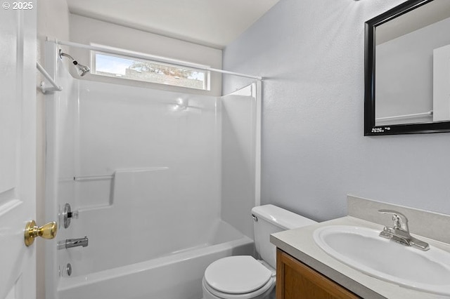 bathroom with toilet, shower / washtub combination, and vanity