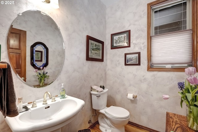 bathroom with sink and toilet