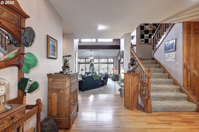 stairway featuring wood-type flooring