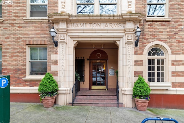 entrance to property with brick siding