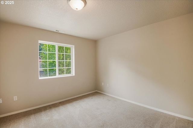 1988 NE 54th Way, Hillsboro, OR 97124 - carpeted spare room with baseboards and a textured ceiling