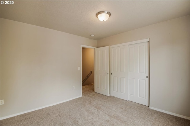 1988 NE 54th Way, Hillsboro, OR 97124 - unfurnished bedroom featuring light colored carpet, a closet, and baseboards