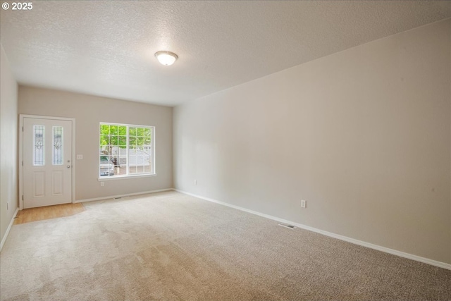 1988 NE 54th Way, Hillsboro, OR 97124 - carpeted empty room featuring a textured ceiling and baseboards