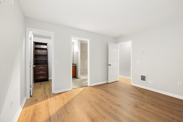 5130 SW Multnomah Blvd Unit H, Portland, OR 97219 - unfurnished bedroom featuring light wood finished floors and ensuite bathroom