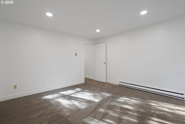 carpeted spare room with baseboards, baseboard heating, and recessed lighting