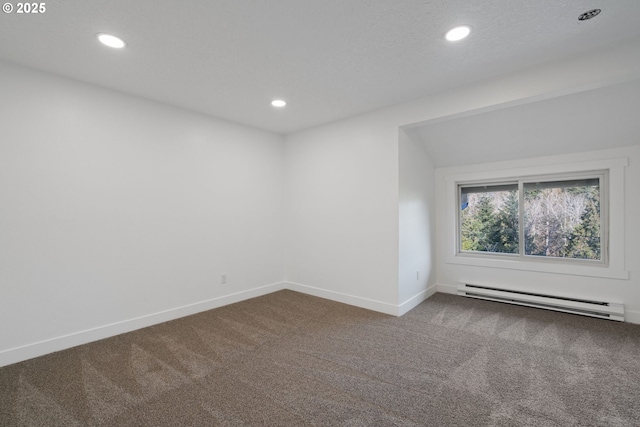 spare room featuring carpet flooring, recessed lighting, baseboards, and baseboard heating