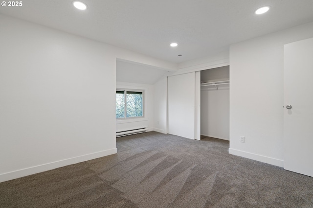 unfurnished bedroom featuring baseboard heating, baseboards, carpet floors, and recessed lighting